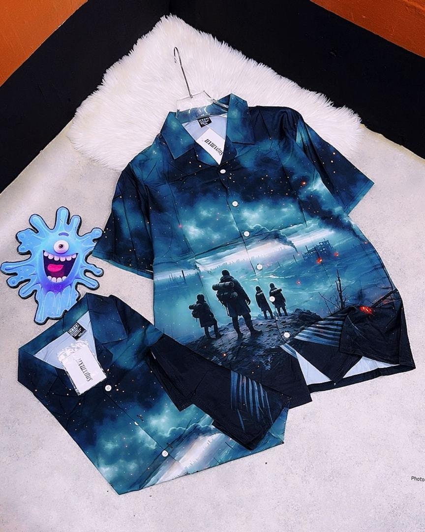 Dark blue short sleeve shirt with space and landscape scene print featuring figures on a hill.