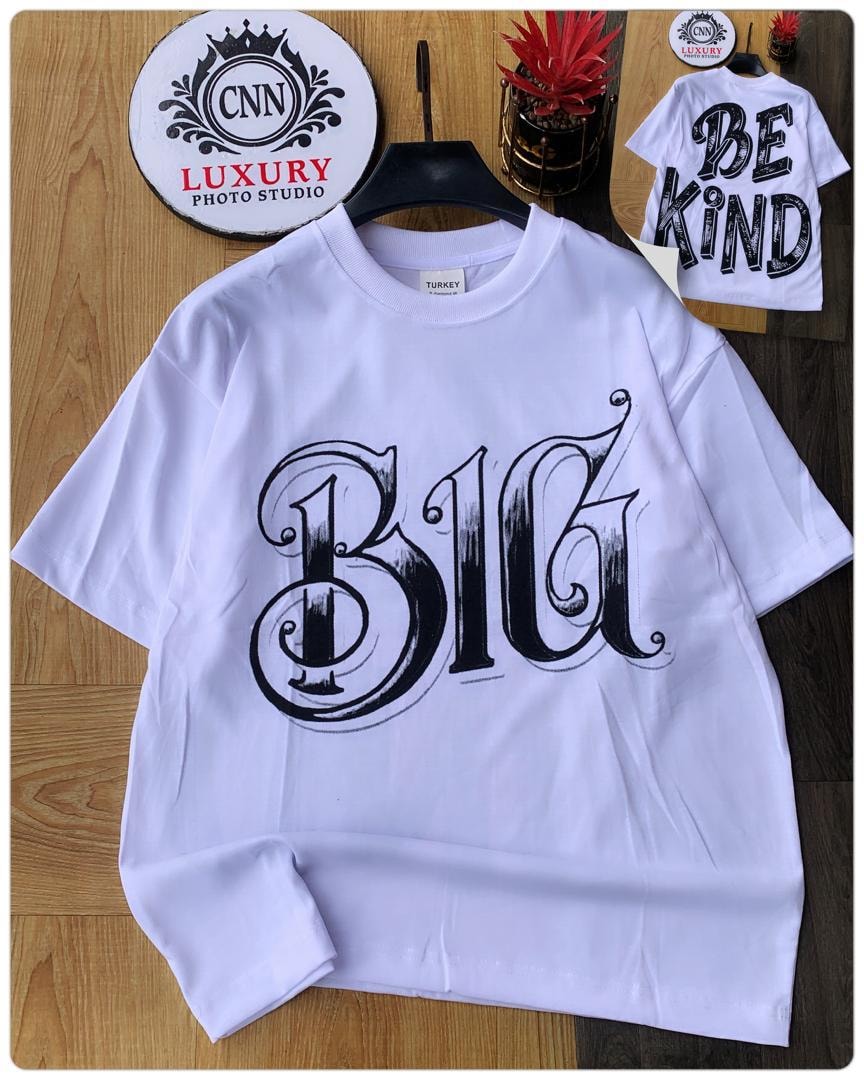 White t-shirt with large black B1G script print on front.