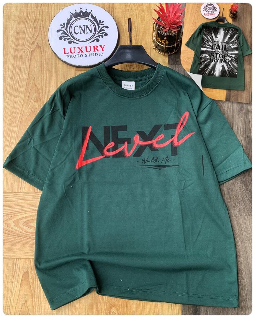 Green t-shirt with Next Level graphic print on chest.