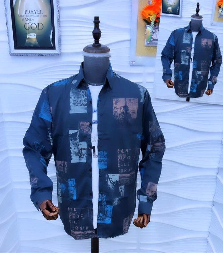 Navy blue city collage print shirt displayed on a mannequin.