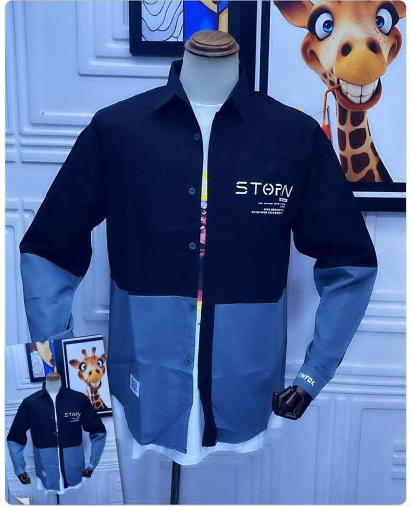Black and blue colorblock button-up shirt on mannequin with STORM logo on chest.