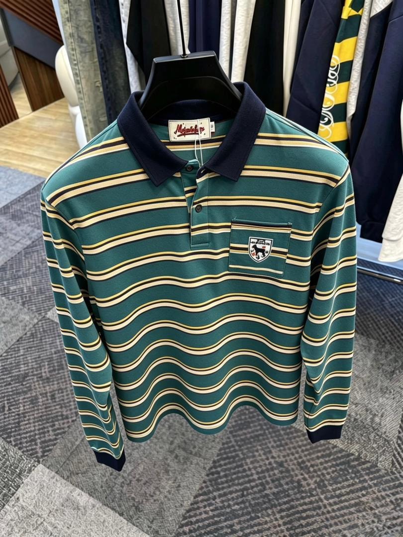 Green and yellow wavy striped long sleeve polo shirt with navy collar on black hanger.
