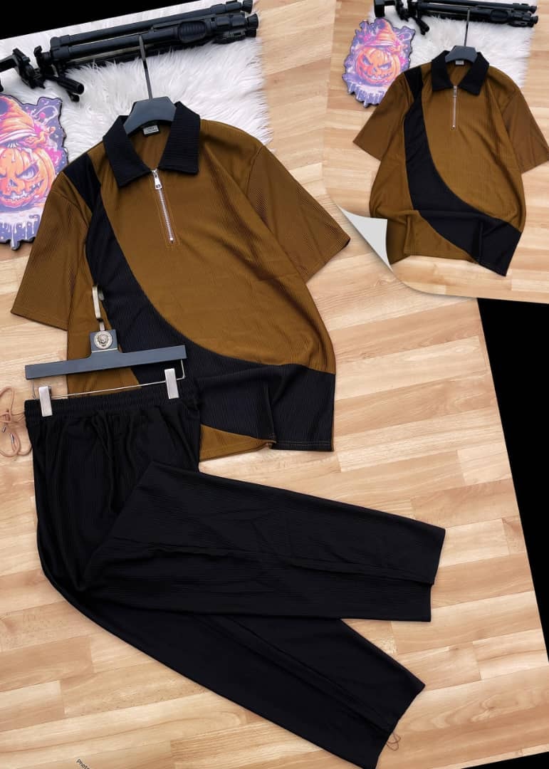 Brown and black ribbed polo two-piece set on wooden floor.
