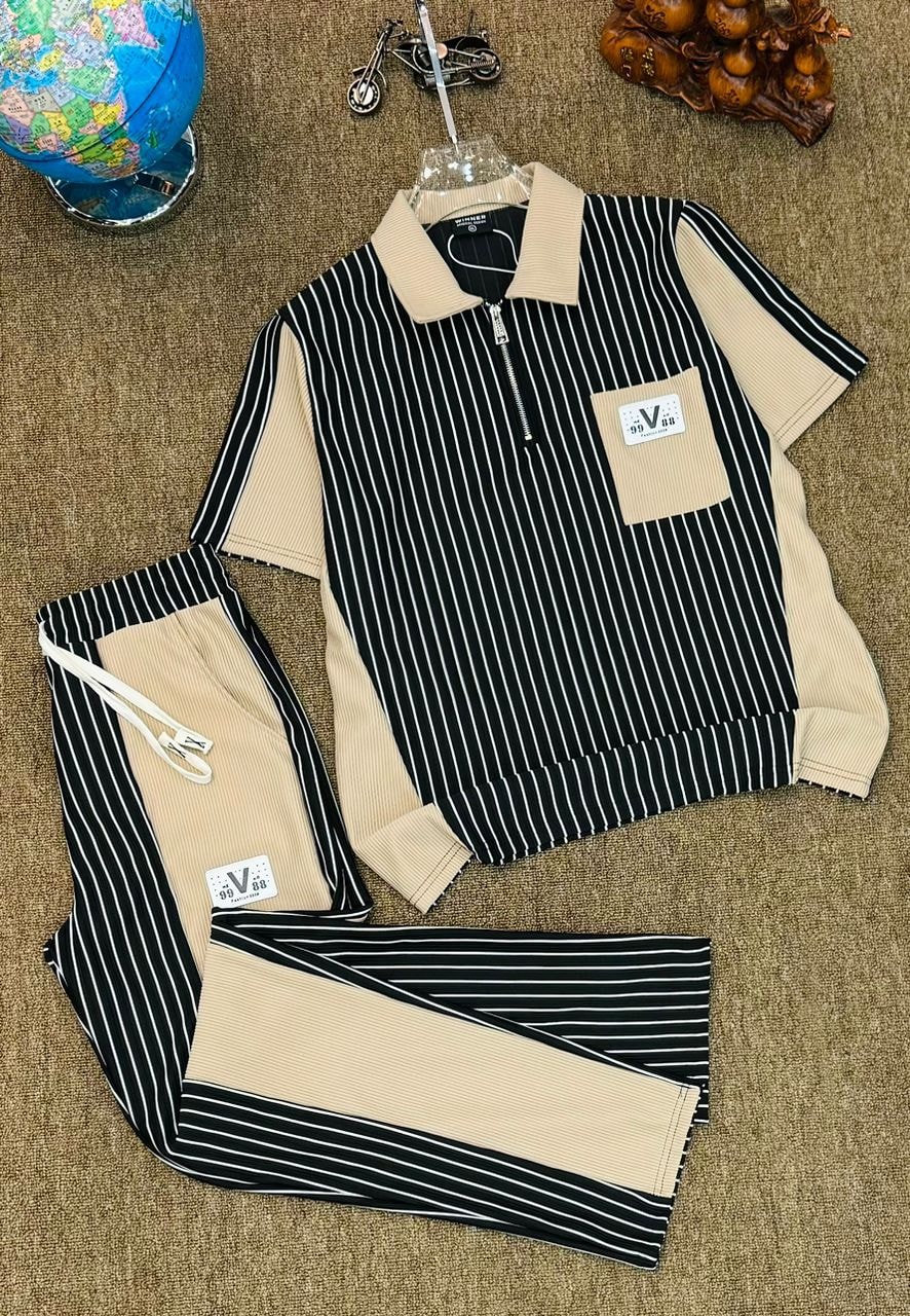 Beige and black striped ribbed two-piece polo set laid flat.