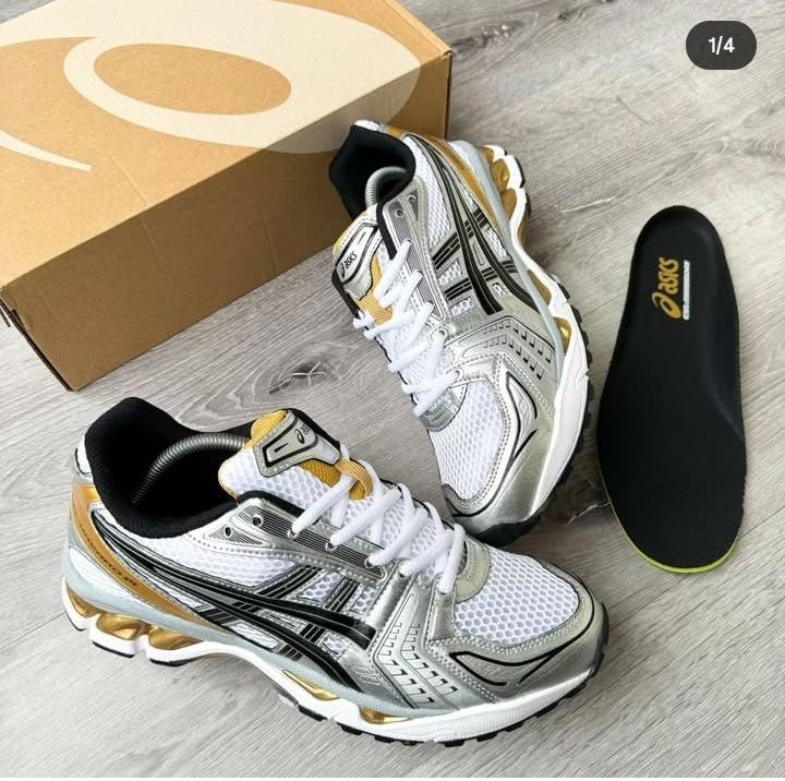 Silver and gold Asics Gel-NYC sneakers with box and insole.