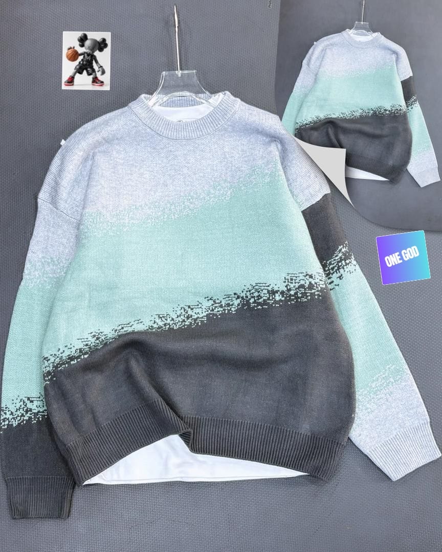 Gray mint and black ombre gradient knit sweatshirt displayed on hanger.