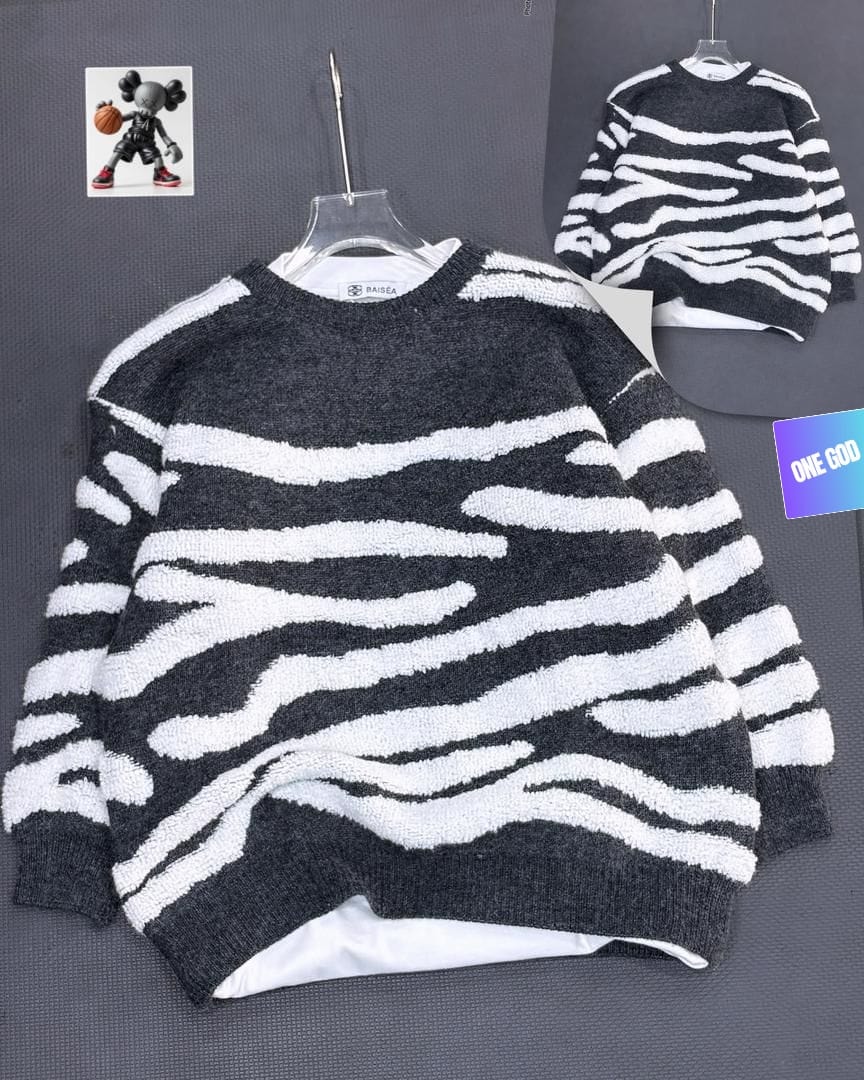 Black base zebra stripe fuzzy knit sweatshirt on hanger showing front and back views.