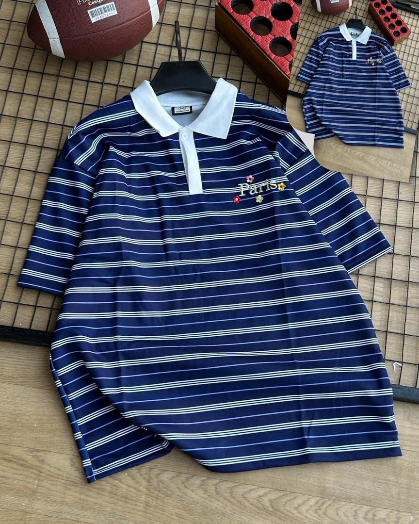 Navy with white striped polo shirt with white collar and chest embroidery.