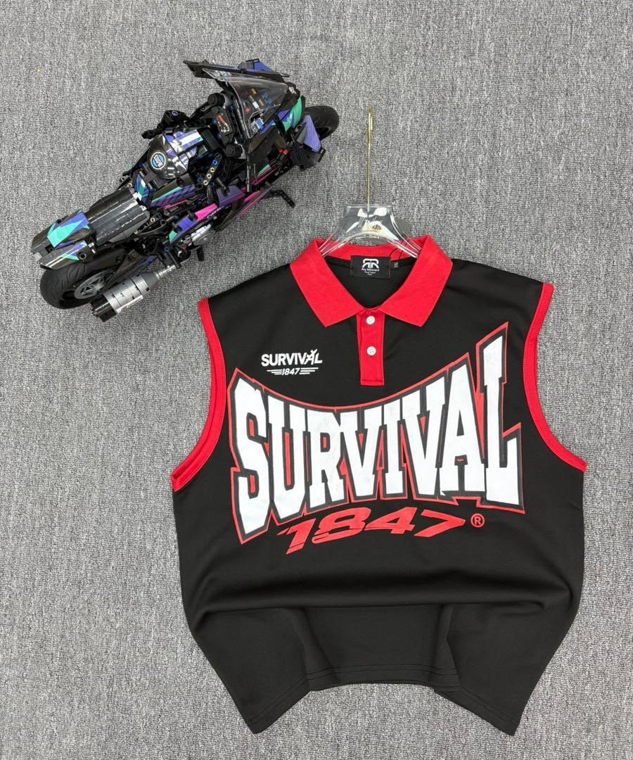 Black sleeveless polo shirt with SURVIVAL 1847 graphic on hanger next to toy motorcycle.