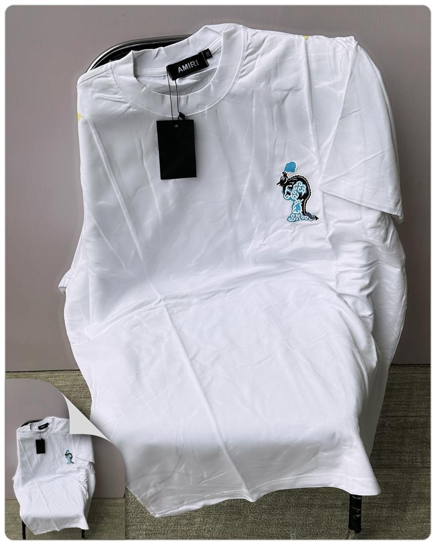 White AMIRI t-shirt with embroidered graphic on the chest.