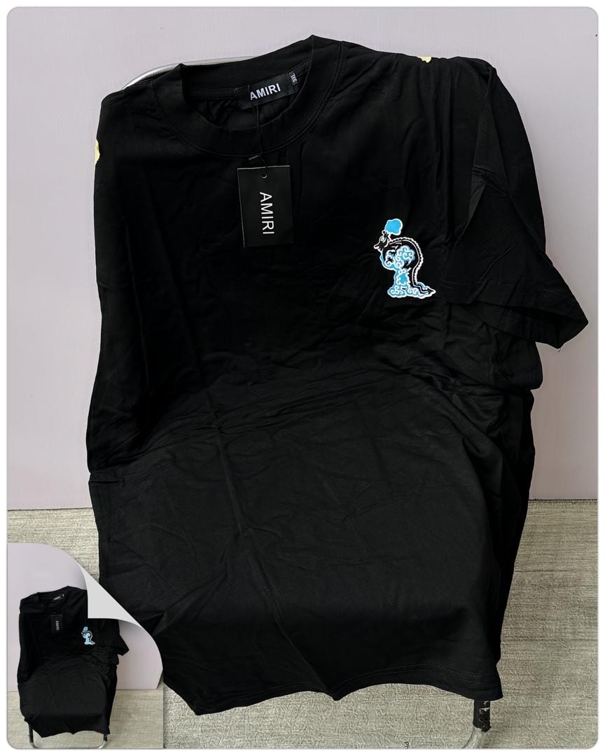 Black AMIRI t-shirt with embroidered graphic on the chest.