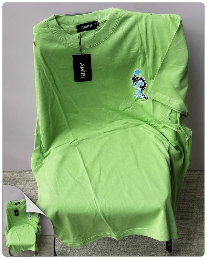 Lime green AMIRI t-shirt with embroidered graphic on the chest.