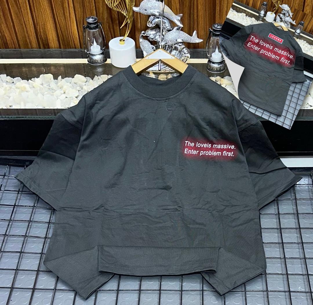 Olive oversized t-shirt on hanger with red gradient chest print 'The loveis massive. Enter problem first.'