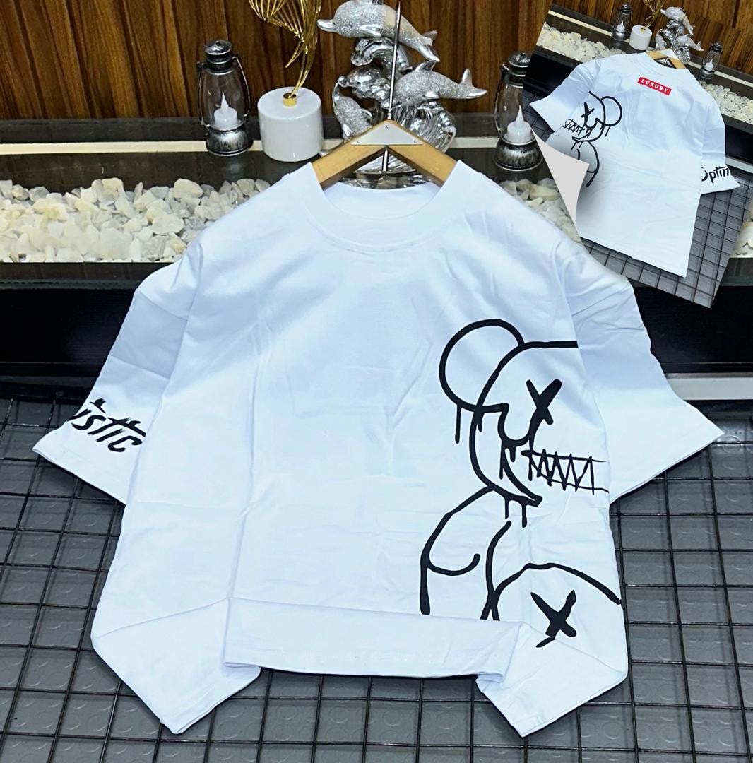 White oversized t-shirt with black abstract figure graphic on front and sleeve.