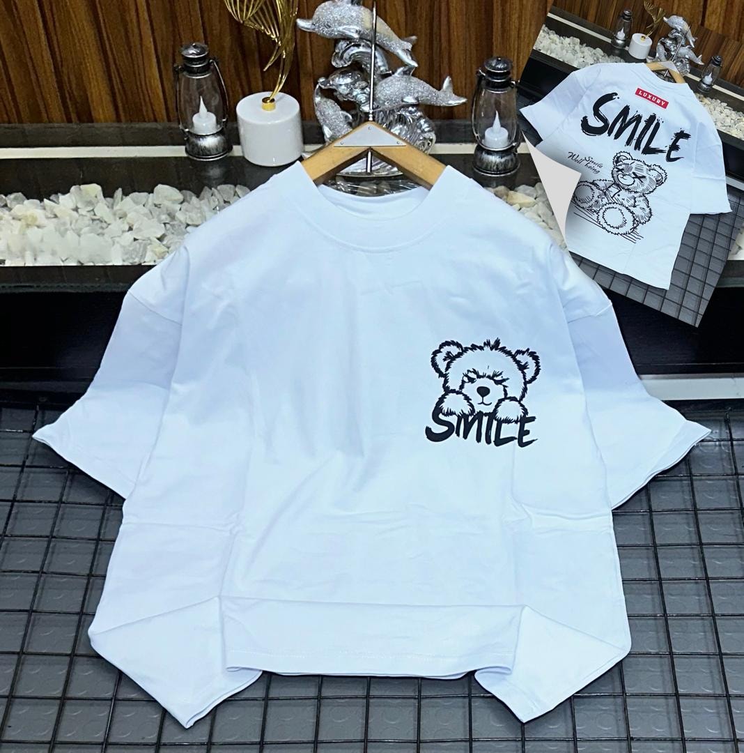 White oversized t-shirt with black bear and SMILE graphic on chest, back view inset.