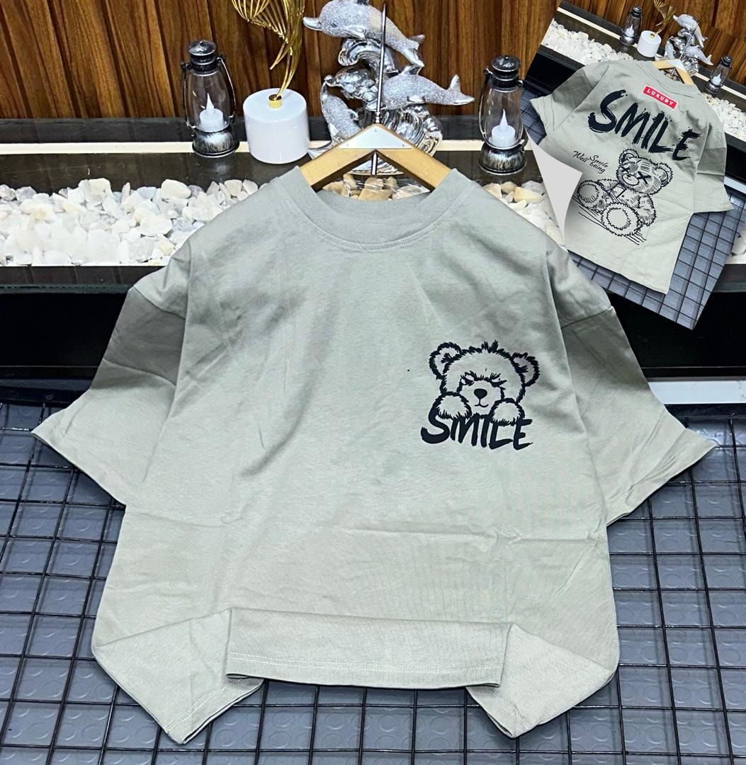 Olive oversized t-shirt with black bear and SMILE graphic on chest, back view inset.