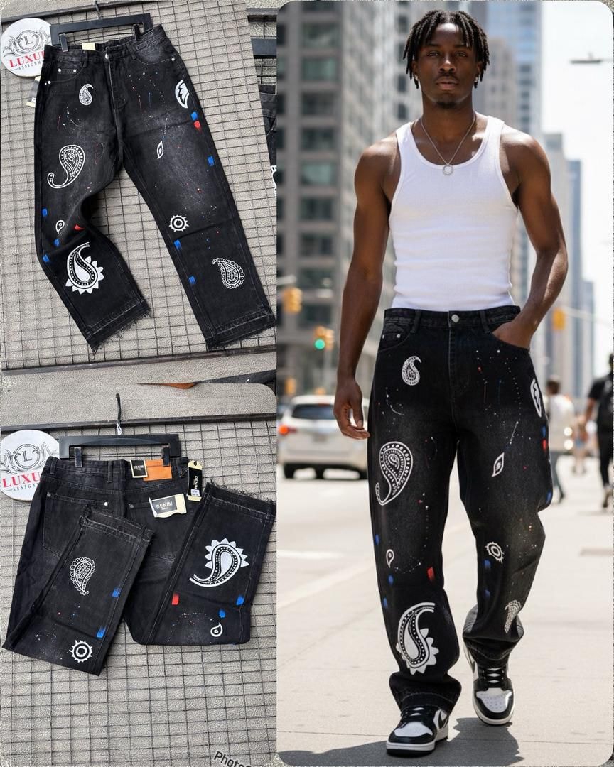 Black jeans with white paisley patterns, paint splatters and multiple views including on model.
