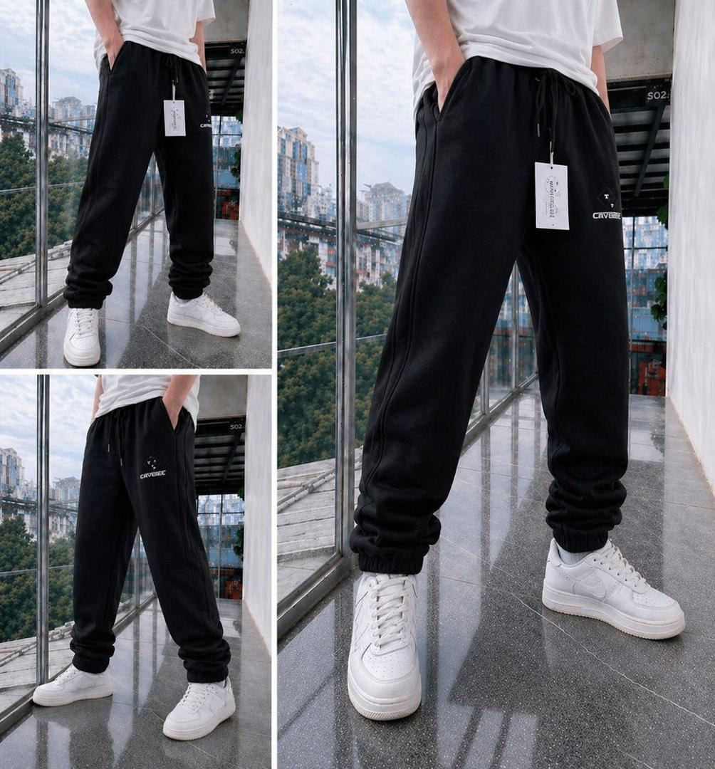 Black fleece joggers shown in multiple angles on a model with white t-shirt and sneakers.