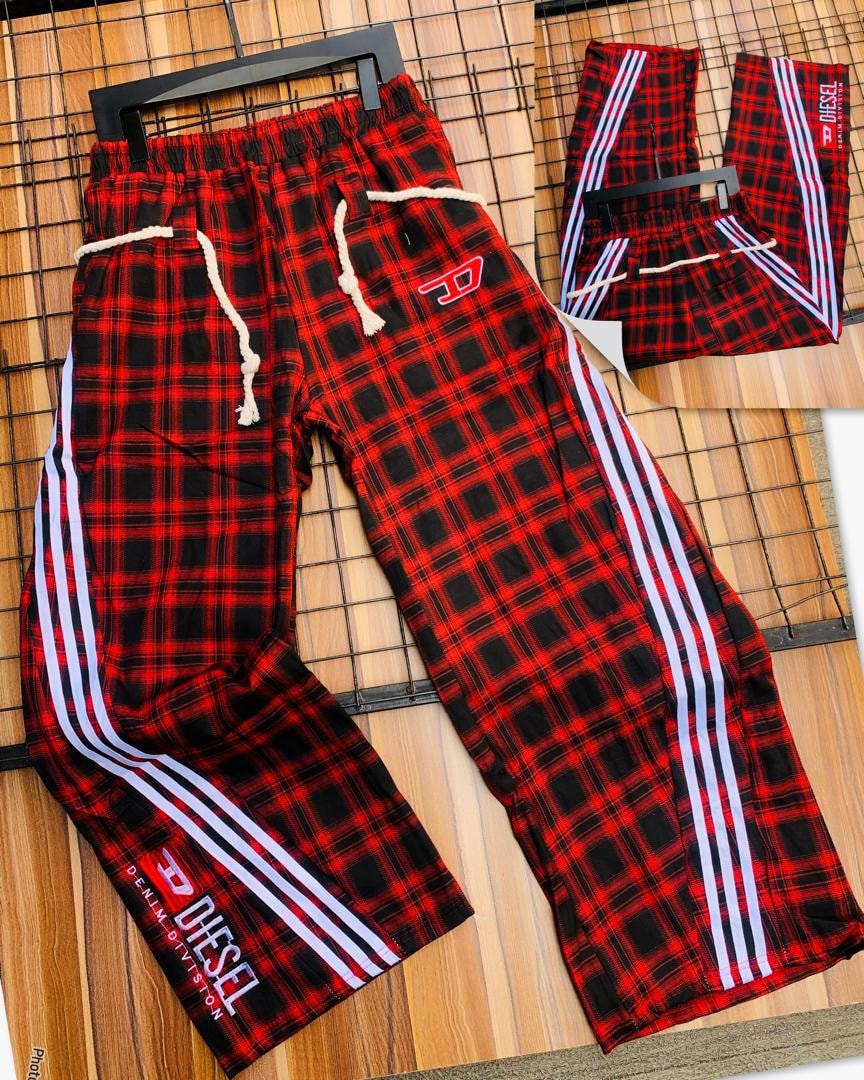 Diesel red plaid joggers on black hanger with white stripes and logo patches.