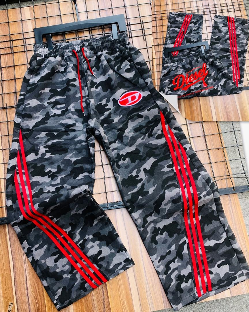 Diesel gray camo joggers on black hanger displaying red stripes and oval logo patch.