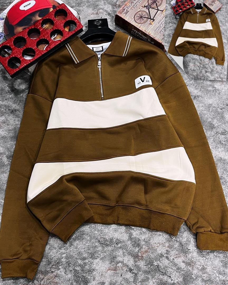Brown striped quarter-zip long sleeve collar top laid flat with accessories.