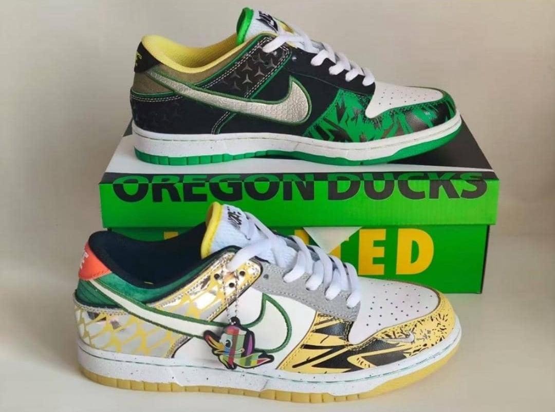 Green black yellow Nike Dunk Low Oregon Ducks sneakers with box and character charm.