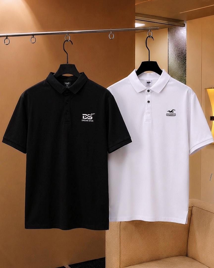 Black Dream Star polo shirt and white polo shirt hanging side by side.