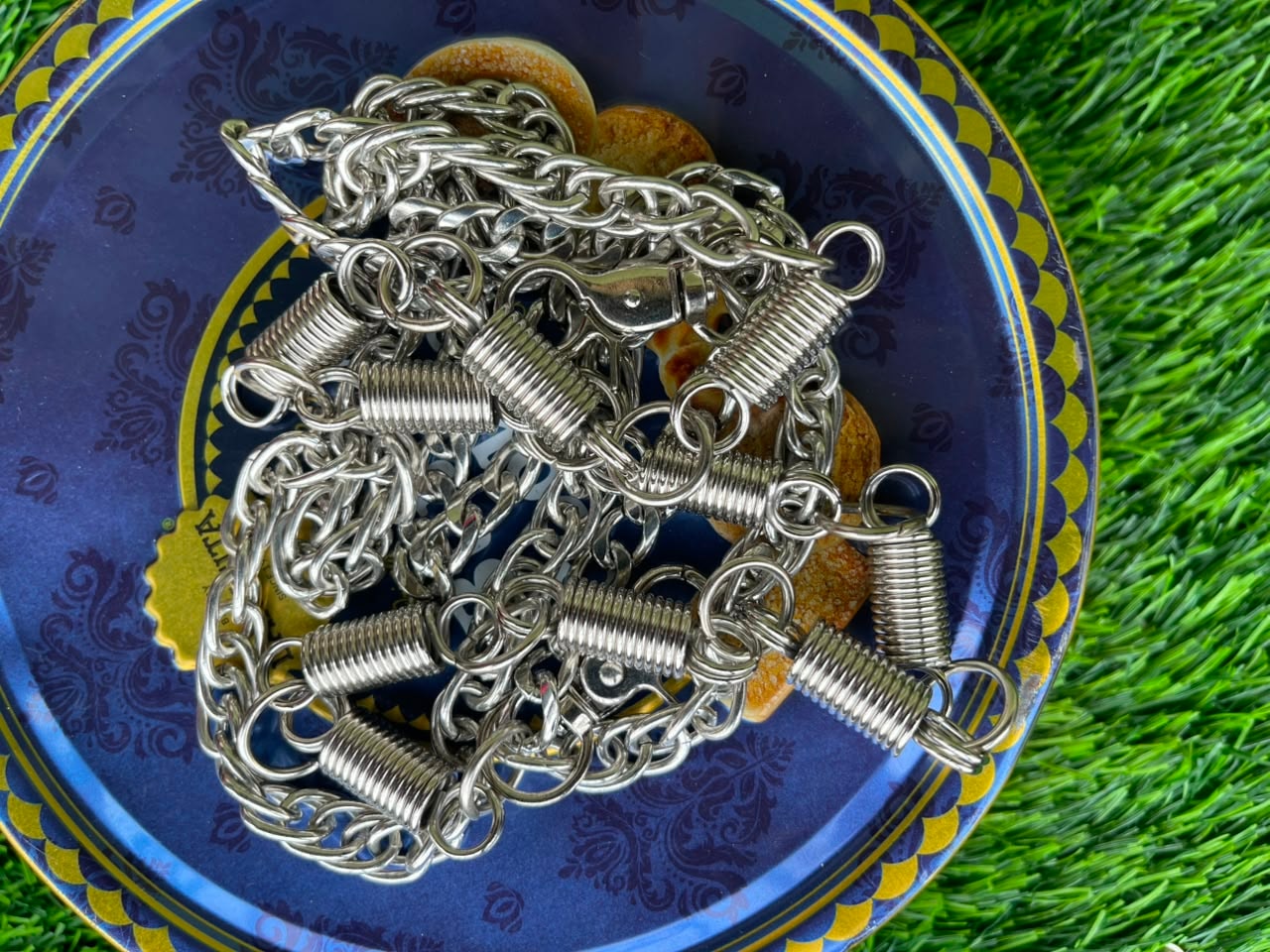Silver chains featuring multiple coiled spring accents and clasps.