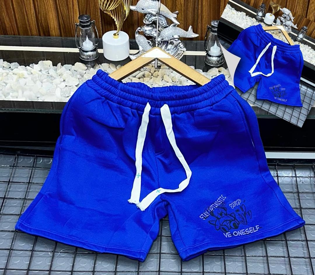 Blue fleece shorts with teddy bear graphic and STAY AUTHENTIC text.