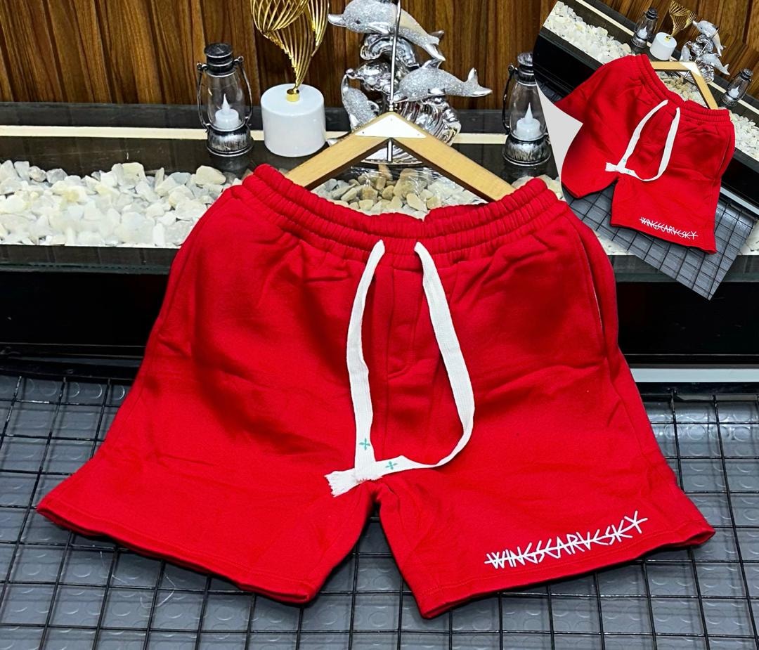 Red fleece shorts with white drawstring and WINGSCARVSKY embroidery on hem.