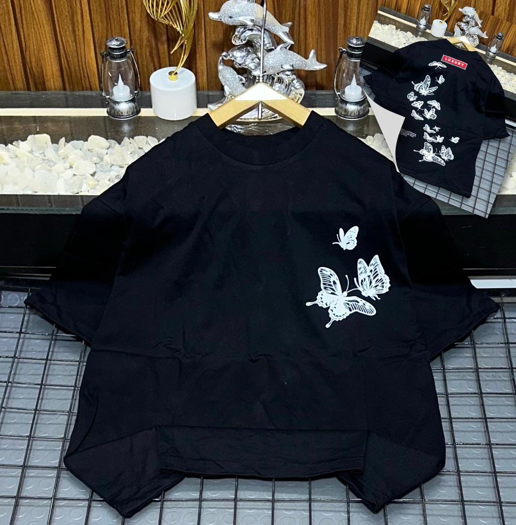 Black oversized t-shirt with white butterfly prints on front and multiple butterflies on back.