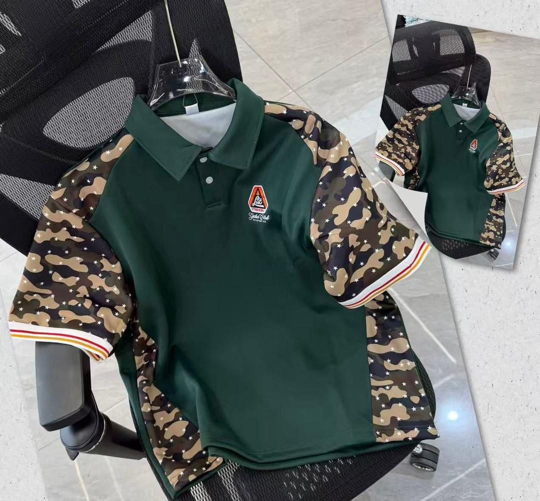 Green polo shirt with camouflage sleeves and striped cuff accents.