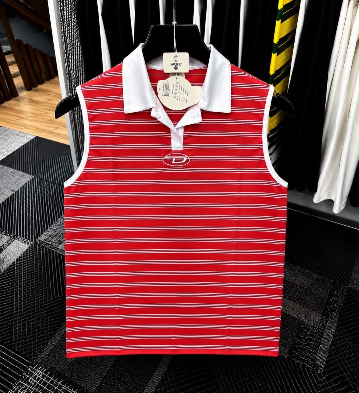 Red striped sleeveless polo top with white collar and oval embroidered logo.