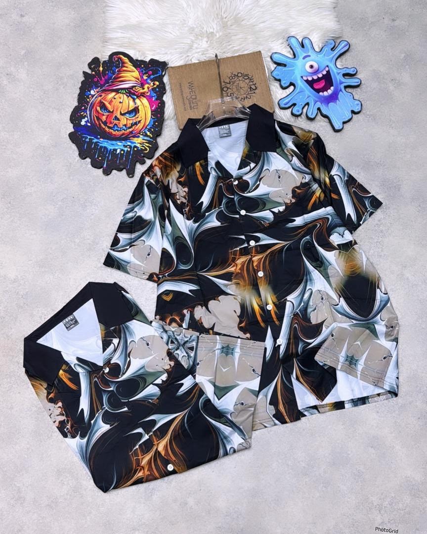 Black short sleeve shirt with white brown and gold marble swirl print.
