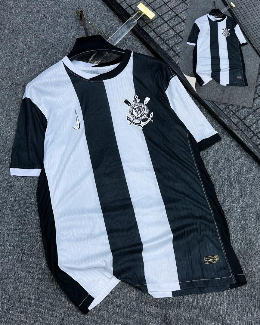 Black and white striped soccer jersey with Corinthians crest and Nike logo.