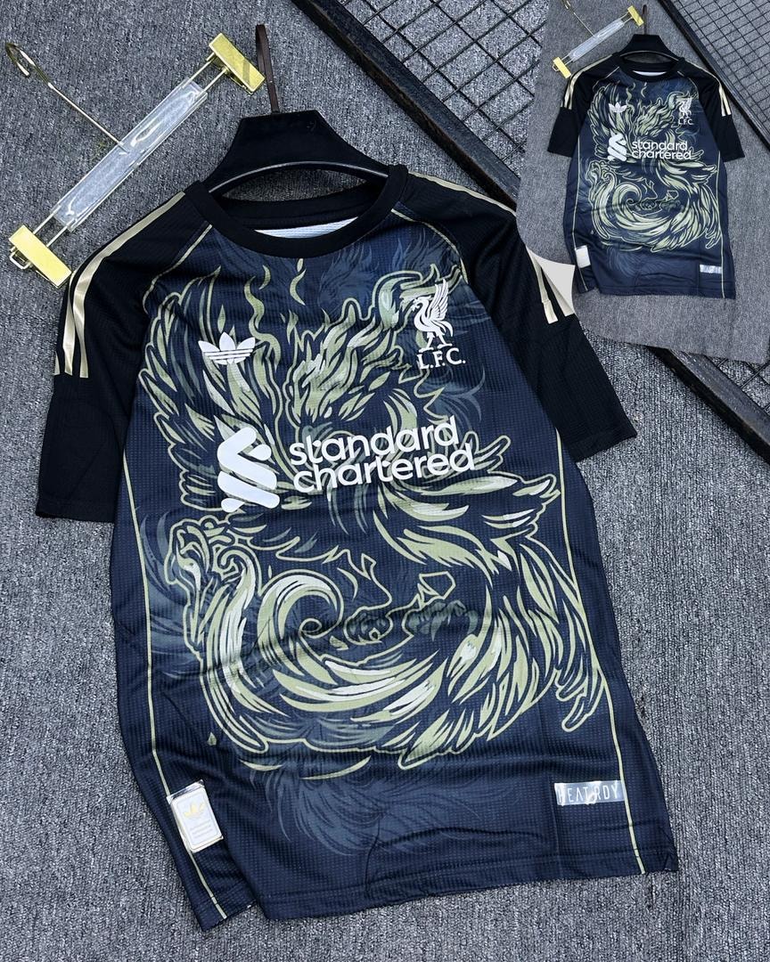 Navy blue Liverpool soccer jersey with wave flame graphic and LFC crest.