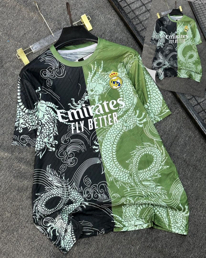 Green and black split soccer jersey with dragon patterns and Real Madrid badge.