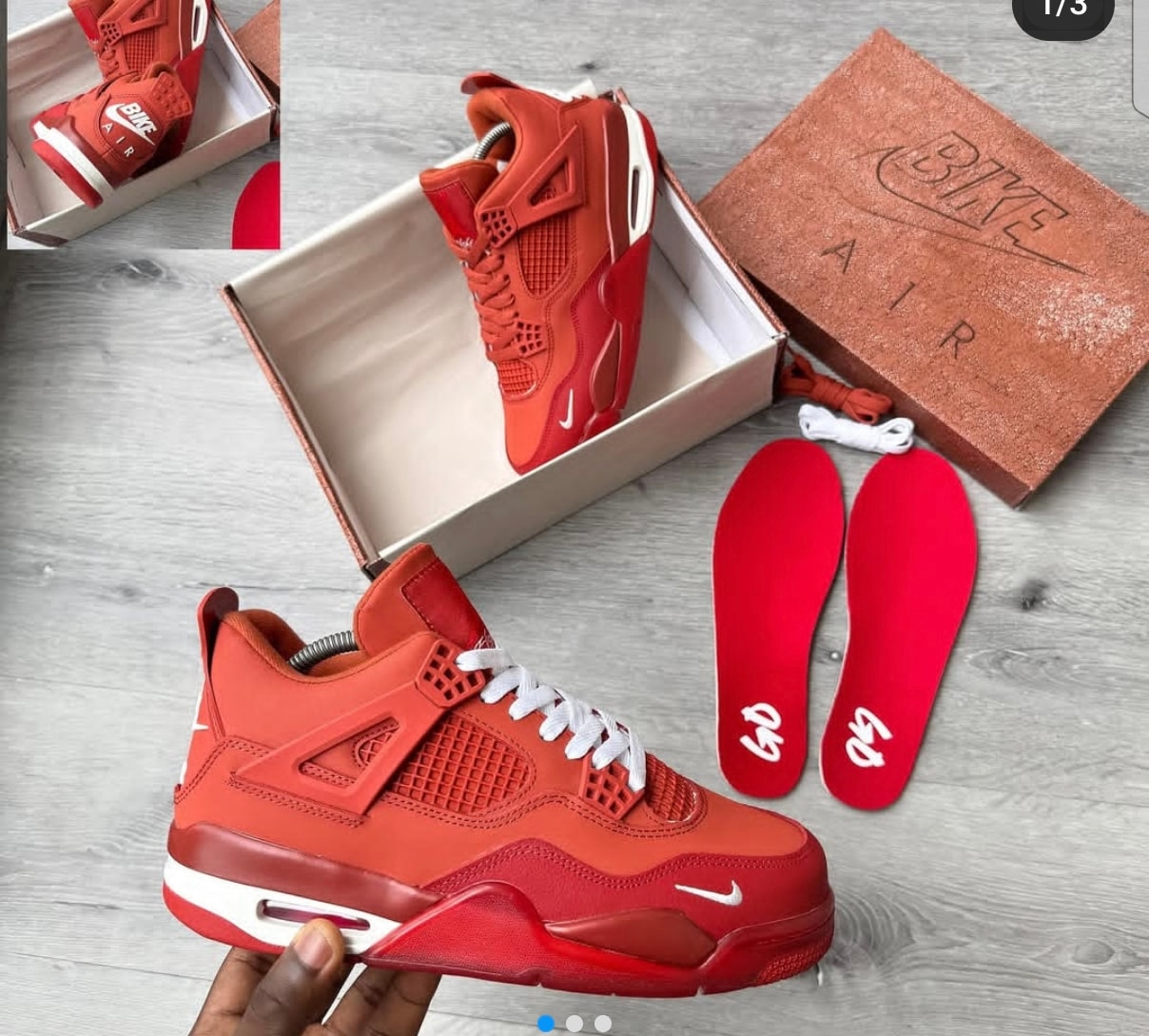 Red Nike Air Jordan 4 sneaker with box, insoles and extra laces.