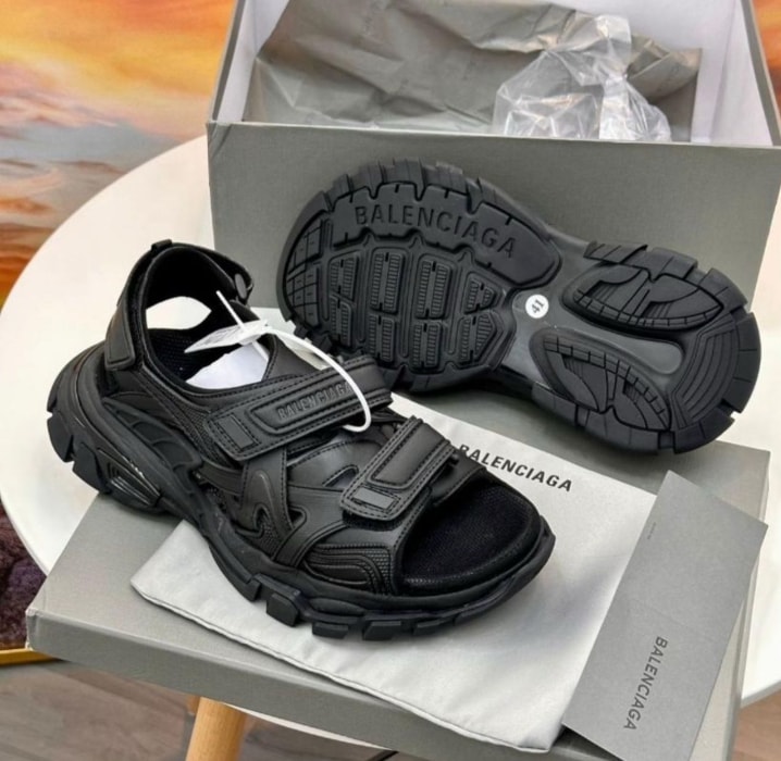 Black Balenciaga sandals with box, dust bag and sole view.