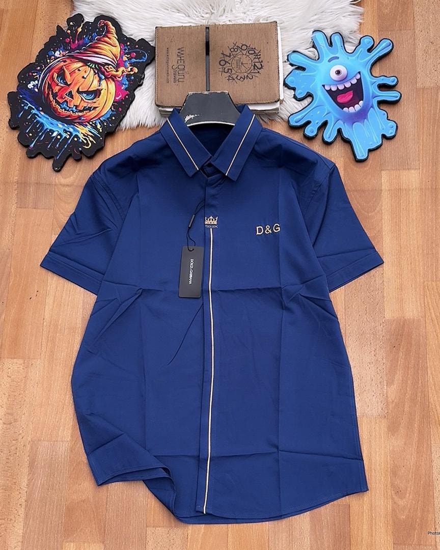 Navy D&G short sleeve shirt with gold piping.