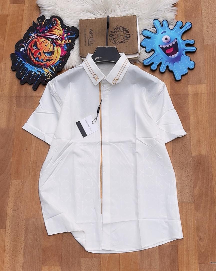 White Calvin Klein monogram short sleeve shirt with detailed collar.
