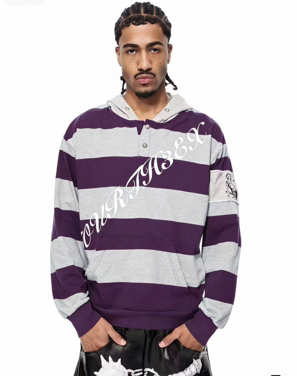 Man wearing purple striped hoodie against white background.