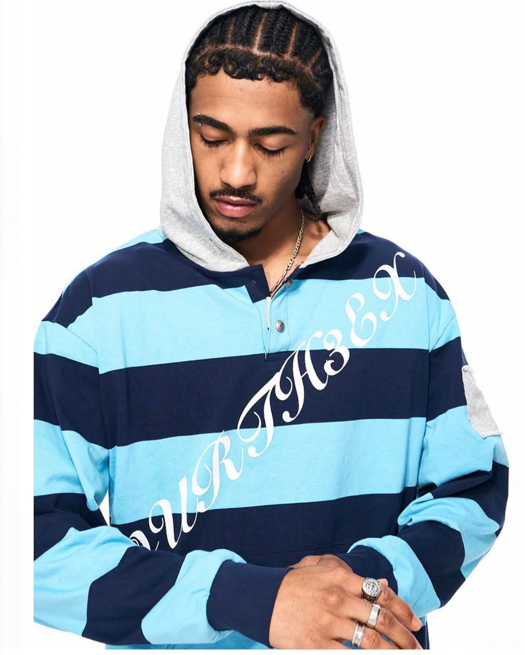 Man modeling blue striped henley hoodie with hood up.
