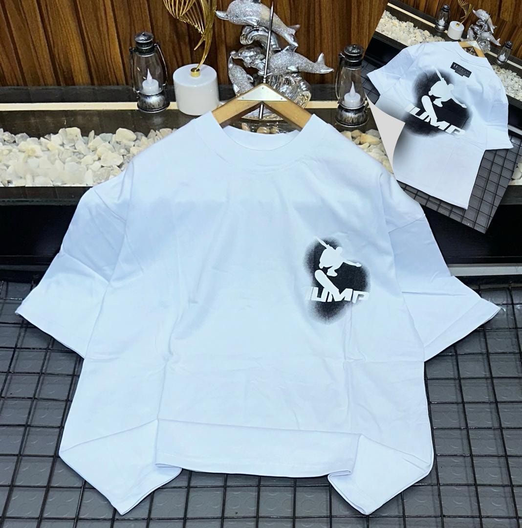 White oversized t-shirt with black skateboarder jump graphic and JUMP text on chest, back view inset.