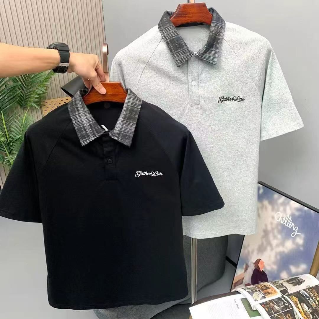 Front views of black and gray GatherLab polos with plaid collars and chest embroidery.