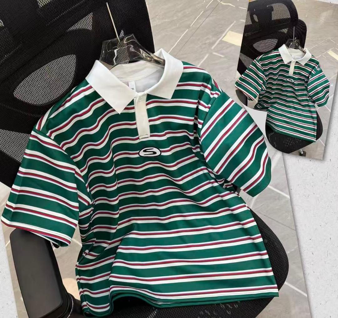 Green wavy striped polo shirt with white collar and S logo on black chair.