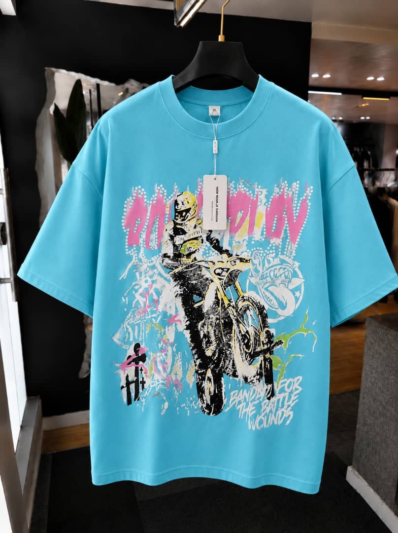 Light blue oversized t-shirt with on the move biker motorcycle graphic print.