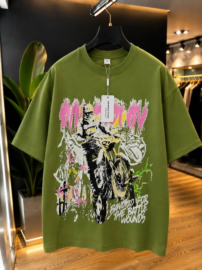 Green oversized t-shirt with on the move biker motorcycle graphic print.