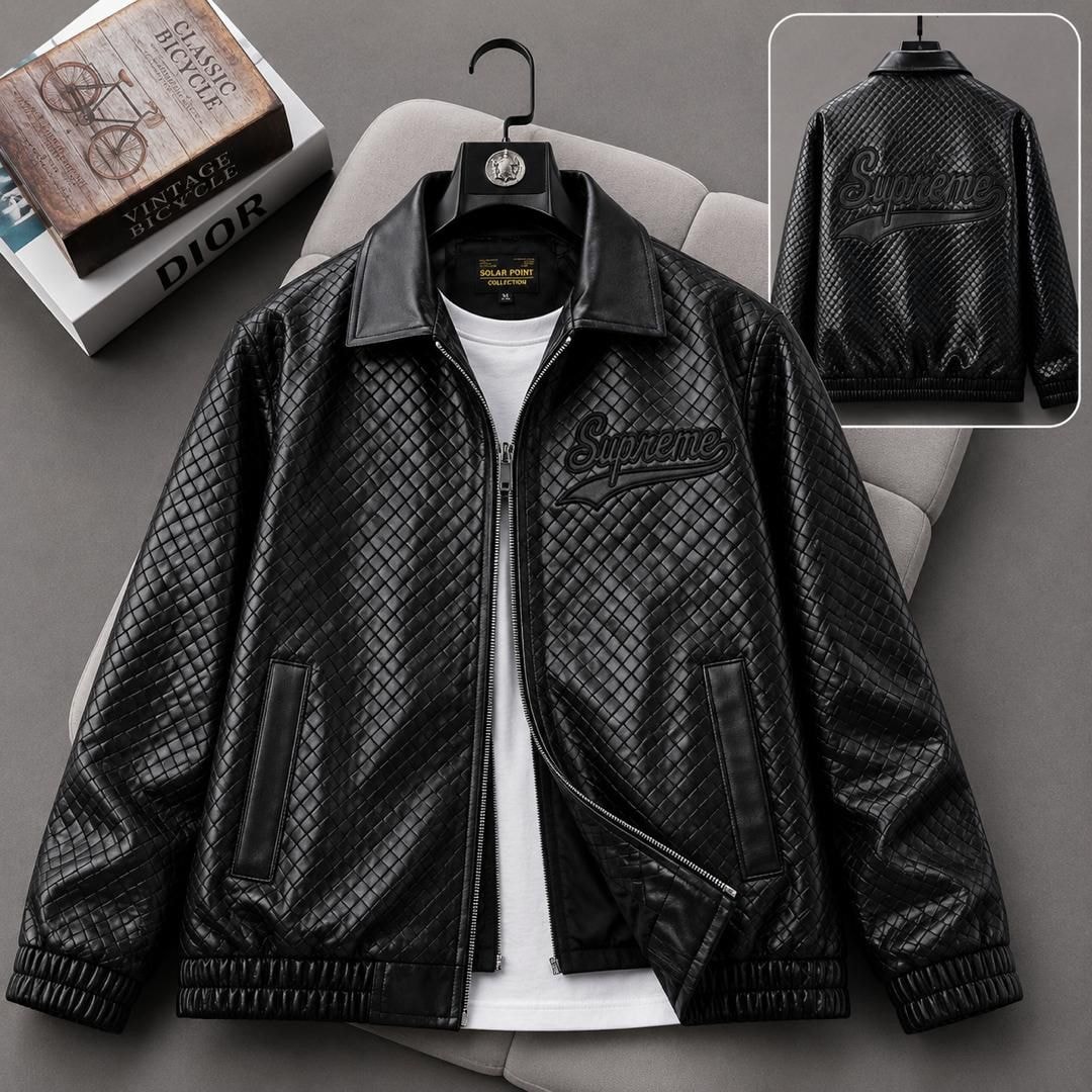 Black Supreme quilted bomber jacket on hanger with back view inset.