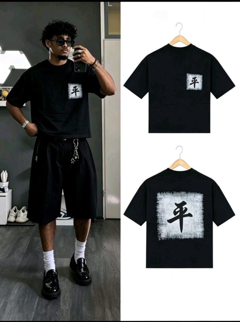 Model wearing black kanji print t-shirt with chest pocket and large back print.